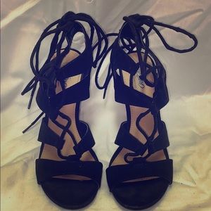 Black strap up heels